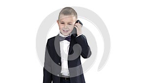 Little boy in a costume making a phone call while walking on white background.