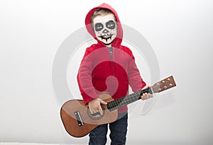Little boy costumed as protagonist of Coco movie
