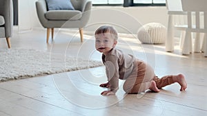 Little Boy Crawling on the Living Room Floor