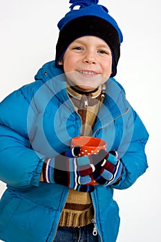 Little boy with cup of hot tea