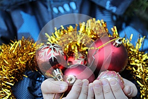 Little boy decorates christmas tree