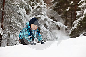 Little boy in deep snow