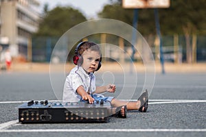 Little boy dj in the schoolyard