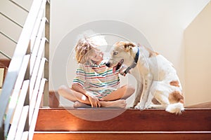 Little boy and dog on stairs
