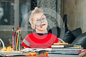 Little boy doing homework in school