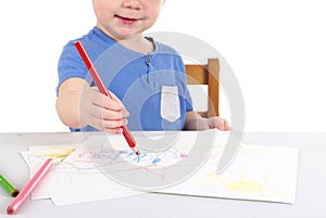 Little boy is drawing the picture