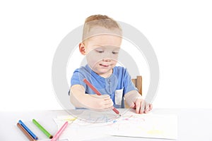 Little boy is drawing the picture