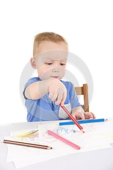 Little boy is drawing the picture