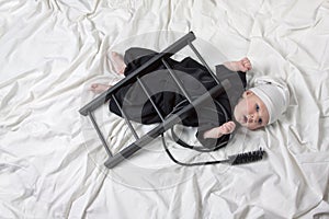 Little boy dressed as a chimney sweep