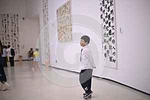 little boy dressed in a white shirt and tie