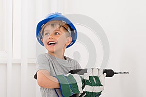 Little Boy Drilling Wall