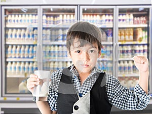 Little boy drinking fresh milk for healthy background of UHT milk storage