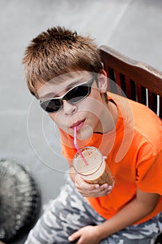 Little boy drinking smoothie
