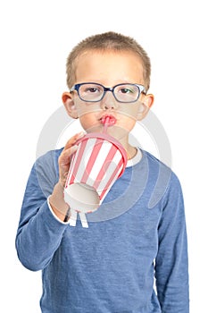 Little boy drinking with straw