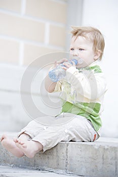 Little boy drinking water