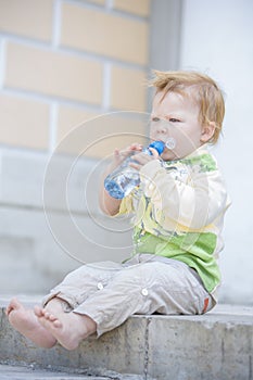 Little boy drinking water