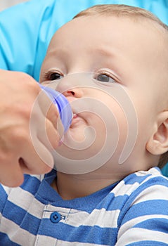 Little boy drinks baby milk