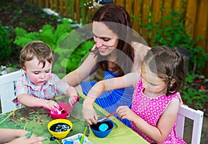 Little Boy Dyeing an Easter Egg Pink