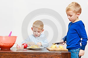 Little boy eating apple for snack