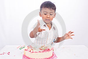 Little boy eating cake