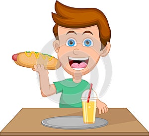 little boy eating a hot dog