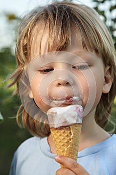 Little boy eating an ice cream