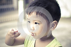 Little boy eating ice cream