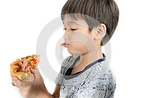 Little boy eating pizza on white background