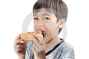 Little boy eating pizza on white background