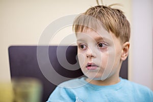 Little boy eating at the table