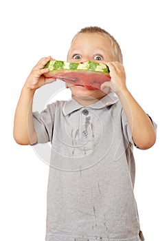 Little boy eating watermelon