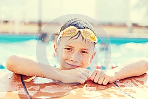 Little boy elbowing at swimming pool