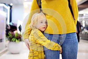 Little boy embrased his mother. Shyness, fears, anxiety