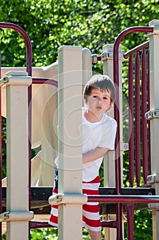 A Little boy enjoying his day at the city park