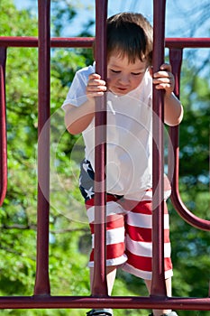 A Little boy enjoying his day at the city park