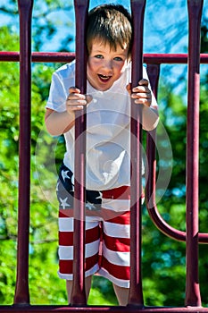 A Little boy enjoying his day at the city park