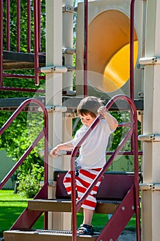 A Little boy enjoying his day at the city park