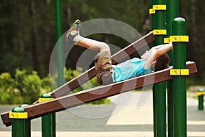 Little boy exercise on the playground