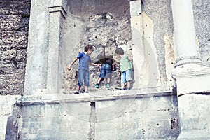 little boy exploring ancient architecture, lifestyle people on summer vacation