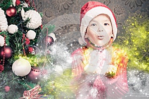 Little boy fairy blowing fairy magical glitter, stardust at Christmas