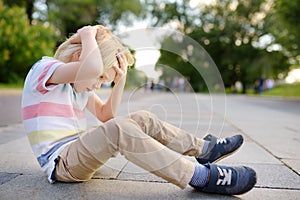 Little boy fell in the street, hit his head. Injury photo