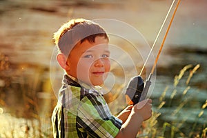 Little boy fishing at lake 2