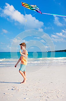 Little boy flying a kite