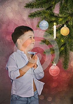 Little boy in front of a Christmas