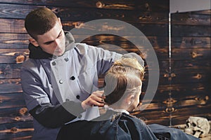 Little Boy Getting Haircut By Barber