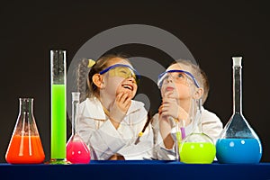 Little boy and girl doing experiments in the laboratory