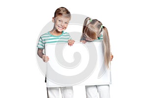 Little boy and girl holding board