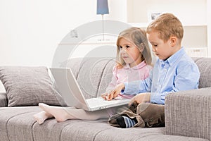 Little boy and girl with laptop