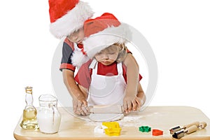 Little boy and girl making christmas cookies