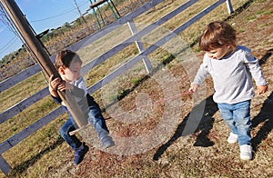 Little boy and girl playing with a zipline